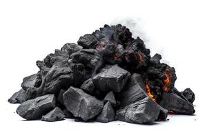 A pile of burning coal. The coal is black and has a rough texture. The fire is orange and yellow, and there is smoke rising from the pile. photo