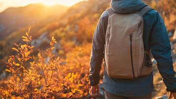 Fleece jacket on a hiker at the edge of a mountain trail, surrounded by autumn foliage, breath visible in the crisp air. Autumn clothing photo