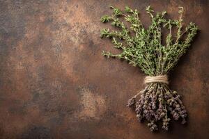 An artful bundle of dried herbs showcases natures beauty, entwined with twine and resting on a rich, rustic surface. This simple composition highlights the charm of natural elements. photo