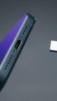 Close-up of type C wire for charging phone. Action. Type-C connector for charging phone on isolated ofn. New wire type C and included for phone video