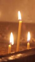 Lighting A Candle With A Match To Get A Romantic Candlelight. Amazing andles and candlesticks are on the table. Stay lights with the peaceful background of religious ceremony. video