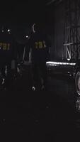FBI agents at the crime scene, rear view. Scene. Agents of the Federal Bureau of Investigation walking in slow motion video