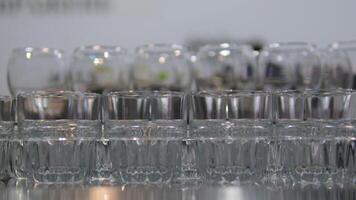 many empty glasses on black background with lights. glasses goblets. empty glasses and goblets video
