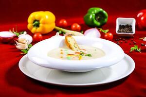 Creamy Mushroom Soup with bread served in bowl isolated on red background closeup side view of arabic food photo