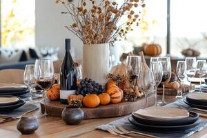 Autumn table setting featuring pumpkins, dried flowers, and neutral toned dinnerware photo