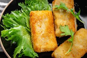fish sticks fish in batter fresh meal food snack on the table copy space food background rustic top view Pescetarian diet photo