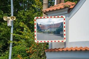 Mirror of spherical type reflecting the cross for improving visibility. Czech photo