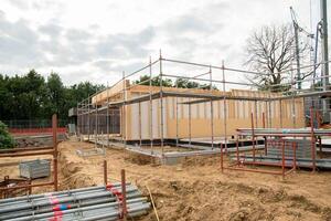 building a house supporting structure for laying bricks around a wooden base, a new House is being built, building materials, High quality photo