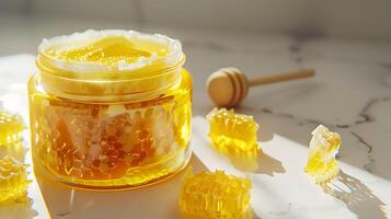 a jar of honey face scrub displayed on a clean white background with a honeycomb design, perfect for natural skincare routines. photo