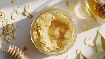 luxurious oatmeal face scrub in a jar, enhanced with oats and honey, displayed on a clean white background photo