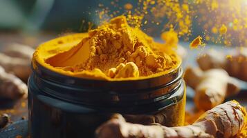 organic turmeric body mask with fresh turmeric roots and powder in a container on a table photo