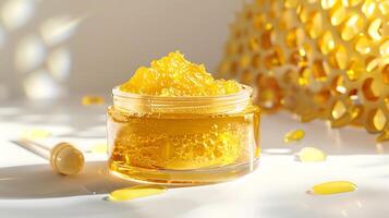 organic honey face scrub in a clear container, displayed on a clean white background beside a honeycomb. photo
