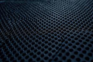 A dark blue mesh texture background featuring an intricate grid pattern photo