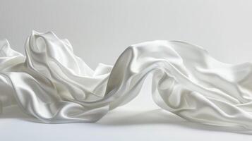 Multiple pieces of white silk satin cloth float gracefully, showcasing smooth textures and reflecting light, creating a soft and dreamy ambiance in the composition photo