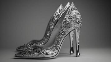 This luxurious pair of high heels features detailed craftsmanship with intricate designs. The elegant shoes are displayed against a simple background, highlighting their beauty and craftsmanship photo
