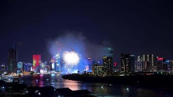 Celebration. Skyline with fireworks light up sky over business district in Ho Chi Minh City - Saigon, Vietnam. Beautiful night view cityscape. video