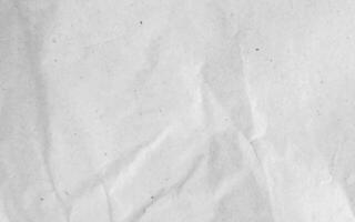 White crumpled craft paper texture as background. Light grey paper texture, Old vintage page or grunge vignette of old newspaper. Pattern rough art creased grunge letter with copy space for text. photo