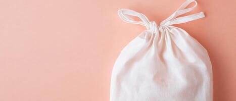 White Canvas Bag on Pink Background. photo