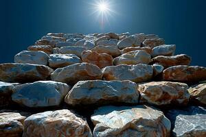 Sunlit Stone Wall Structure Against Clear Blue Sky with Radiant Sunburst - Architectural Photography for Design, Print, Poster photo