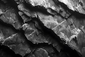 Abstract Layers of Cracked Black and White Surface with Sharp Edges for Creative Background Design photo