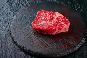Kobe A4 Tenderloin. Kobe beef is some of the rarest and most highly-prized varieties of wagyu, and commonly fetches some of the highest price tags for beef in the world. photo