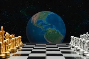 Chess pieces on a board game with the world and space background photo