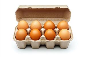 An open egg box containing ten brown eggs is isolated on a white background, emphasizing fresh organic chicken eggs stored in a carton pack with ample copy space provided. photo