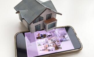 Controlling home heating temperature with a smart home, close-up on phone. Concept of a smart home and mobile application for managing smart devices at home photo
