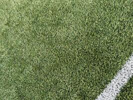 green field in soccer stadium. ready for game in the midfield photo