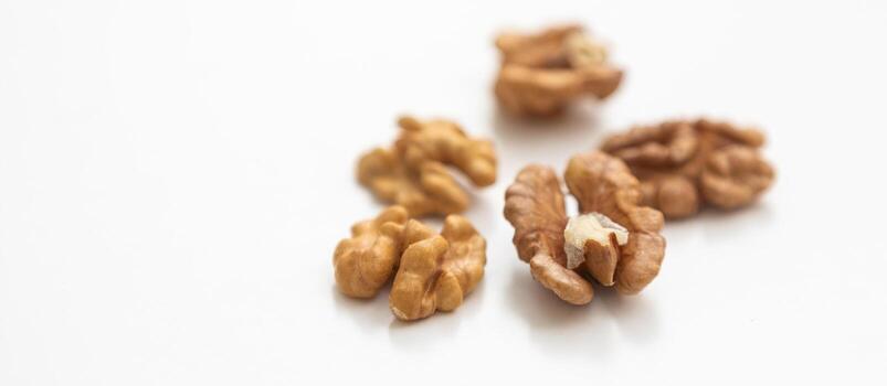 Half a walnut isolate. Peeled walnut on white. Walnut top view. Set with clipping path. Full depth of field photo