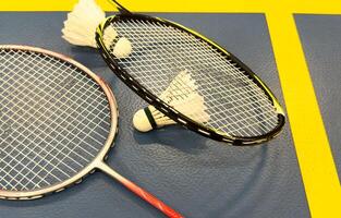 Competitive sports and high performance in tournament match conceptual idea with badminton rackets and shuttlecock with copy space photo