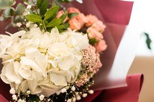 Colorful bouquet of different fresh flowers . Bunch of orchids, roses, freesia and eucalyptus leaves. Rustic flower background. Top view photo