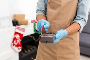 Payment on a trade through contactless card and NFC technology. Front view. Horizontal composition. photo