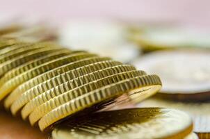Close up of side view of golden coins. This is suitable banking, wealth and business concept photo