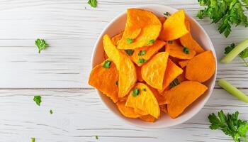 Pumpkin fried chips snack homemade in plate wooden background photo