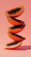 A stack of papaya slice fruit balancing on top with solid background photo