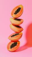 A stack of papaya slice fruit balancing on top with solid background photo