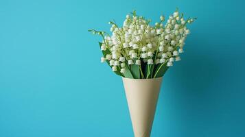 Lily of the valley flower on brown paper wrap bouquet eco friendly package solid background photo