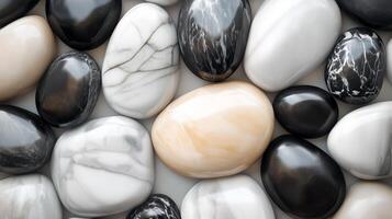 Abstract pattern black and white gravel stones smooth glossy texture marble polished photo