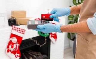 Payment on a trade through contactless card and NFC technology. Front view. Horizontal composition. photo