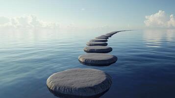 Stepping grey stones with texture forwarding in beach sand and ocean water with bright sky photo