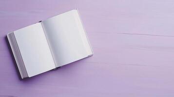 Blank white open book for texting information and purple copy space background photo