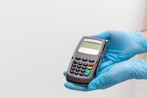 Payment on a trade through contactless card and NFC technology. Front view. Horizontal composition. photo