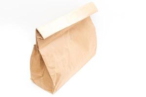 brown clear empty blank craft paper bag for takeaway isolated on white background. Packaging template mock up. Delivery service concept. Copy space. photo