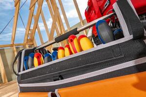 Colorful Tools Arranged Neatly in a Toolbox at a Construction Site on a Sunny Day photo