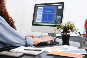 Hands of a person making a communication graphic template on a computer. photo