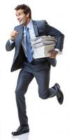 A man in a suit is running with a stack of papers in his arms. He is smiling and he is in a hurry. photo