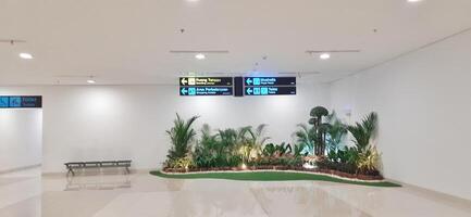 Atmosphere and view of passengers activity at Sultan Hasanuddin International airport terminal. Makassar, South Sulawesi, Indonesia - September 7 2024 photo