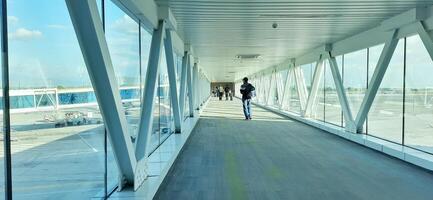 Atmosphere and view of passengers activity at Sultan Hasanuddin International airport terminal. Makassar, South Sulawesi, Indonesia - September 7 2024 photo