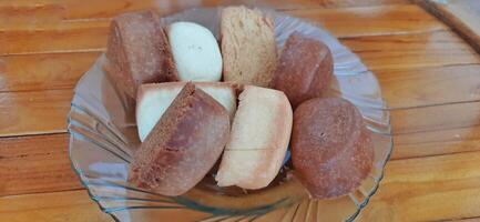 Fried mantau bread or roti mantau is served on a plate photo